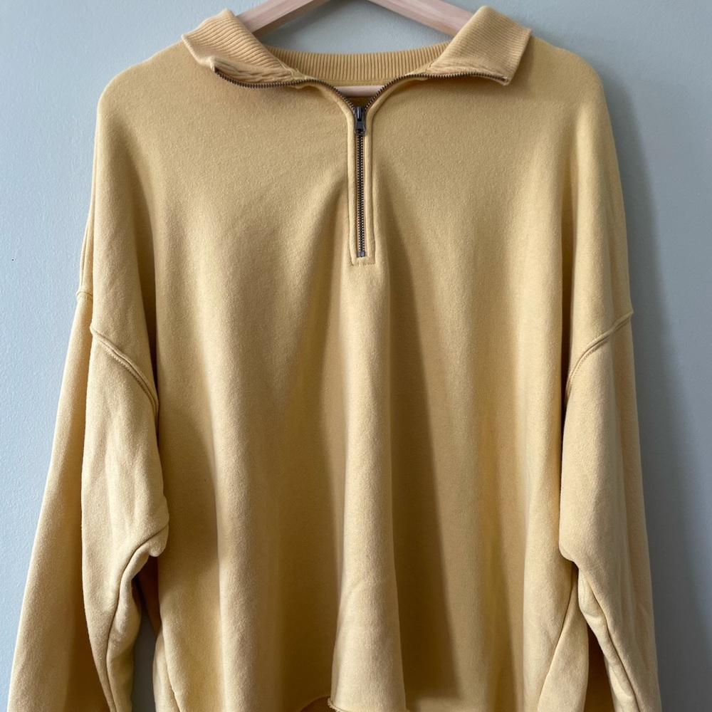 Yellow aerie zip up sweater.